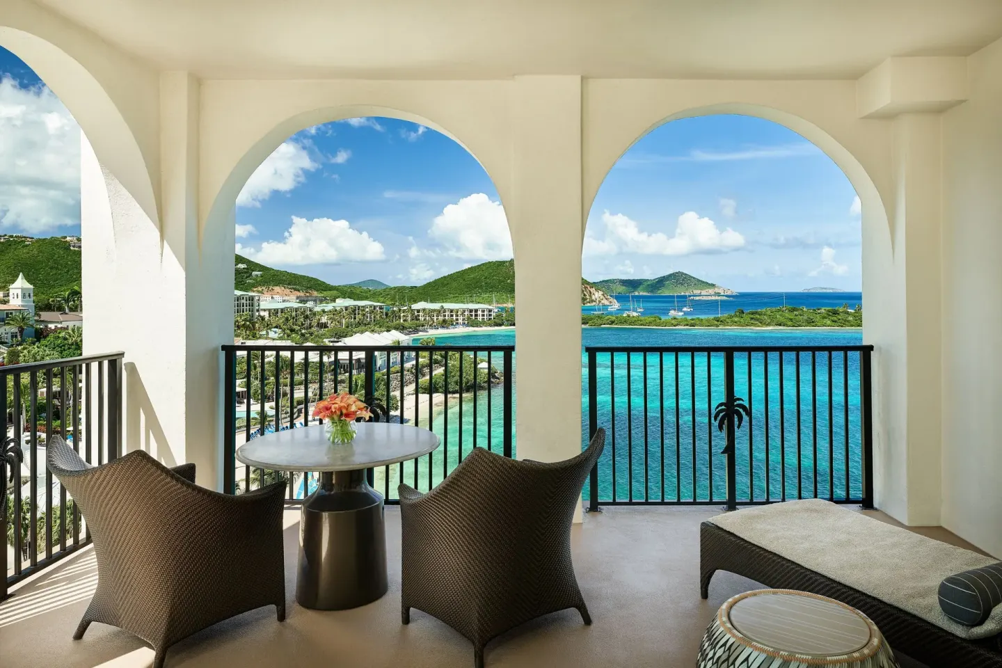 Furnished Club Oceanfront Room balcony with sea and island views at The Ritz-Carlton, St. Thomas.