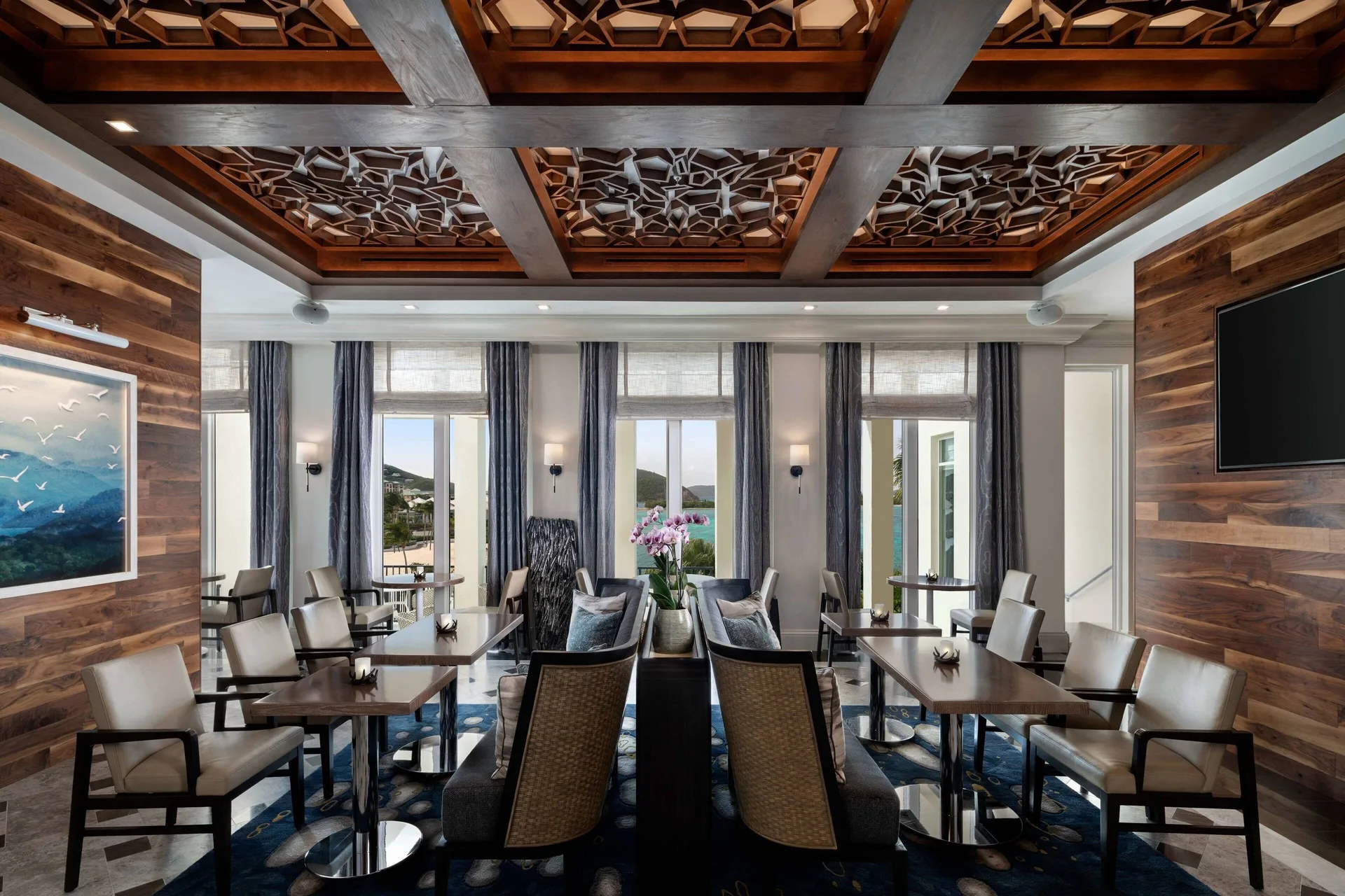 Club lounge seating area with tables at The Ritz-Carlton, St. Thomas.