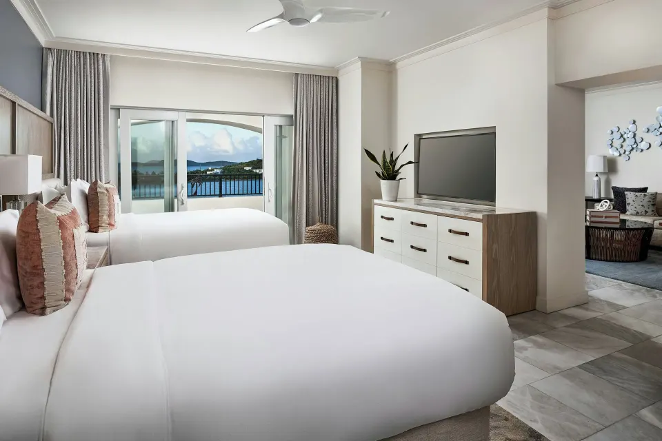 Club Suite with multiple beds and balcony view at The Ritz-Carlton, St. Thomas.