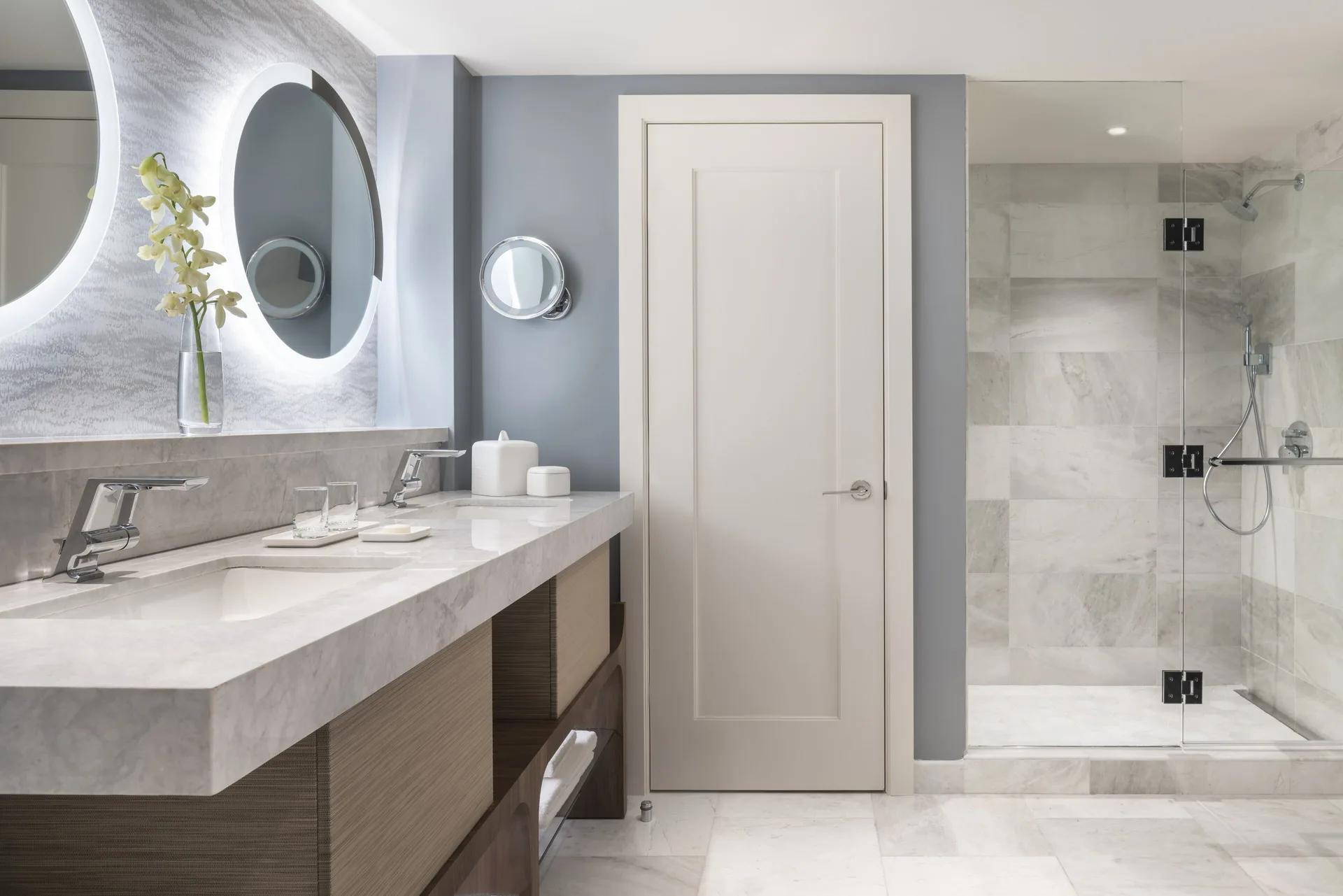 Executive Suite bathroom at The Ritz-Carlton, St. Thomas with double vanity and glass shower.