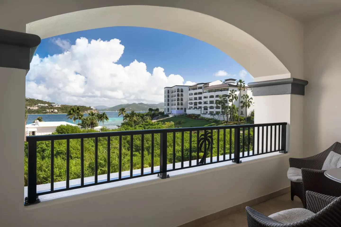 Covered Ocean View Room balcony with seating at The Ritz-Carlton, St. Thomas.