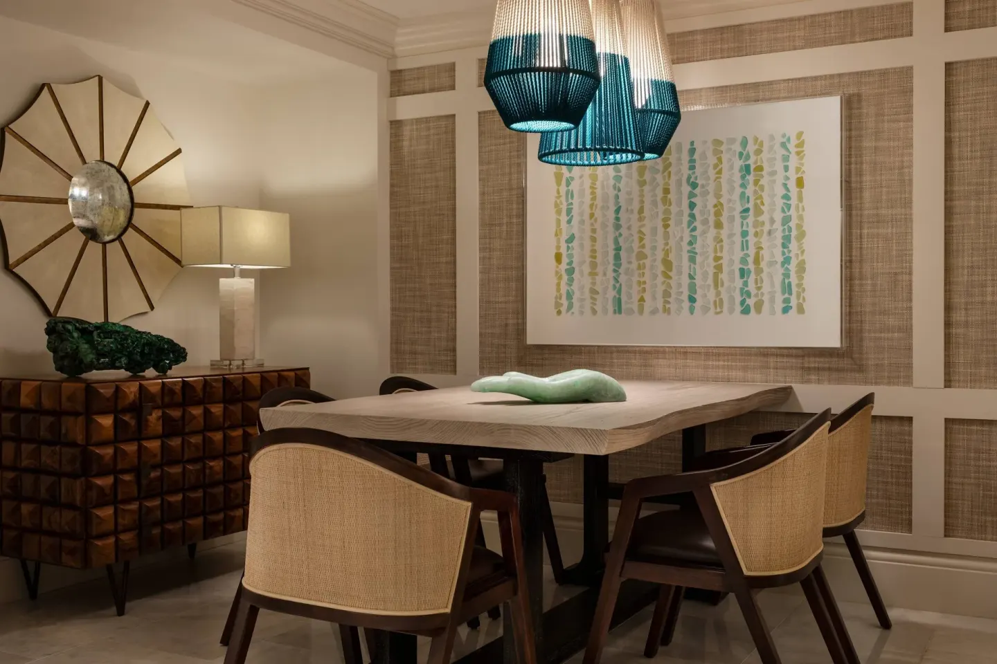 Presidential 1 Bedroom Suite dining area at The Ritz-Carlton, St. Thomas with woven chairs.