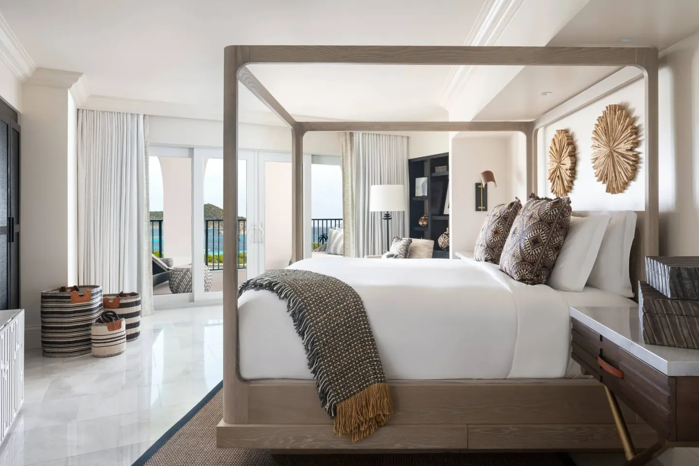 Presidential 1 Bedroom Suite king bed at The Ritz-Carlton, St. Thomas with balcony beyond.