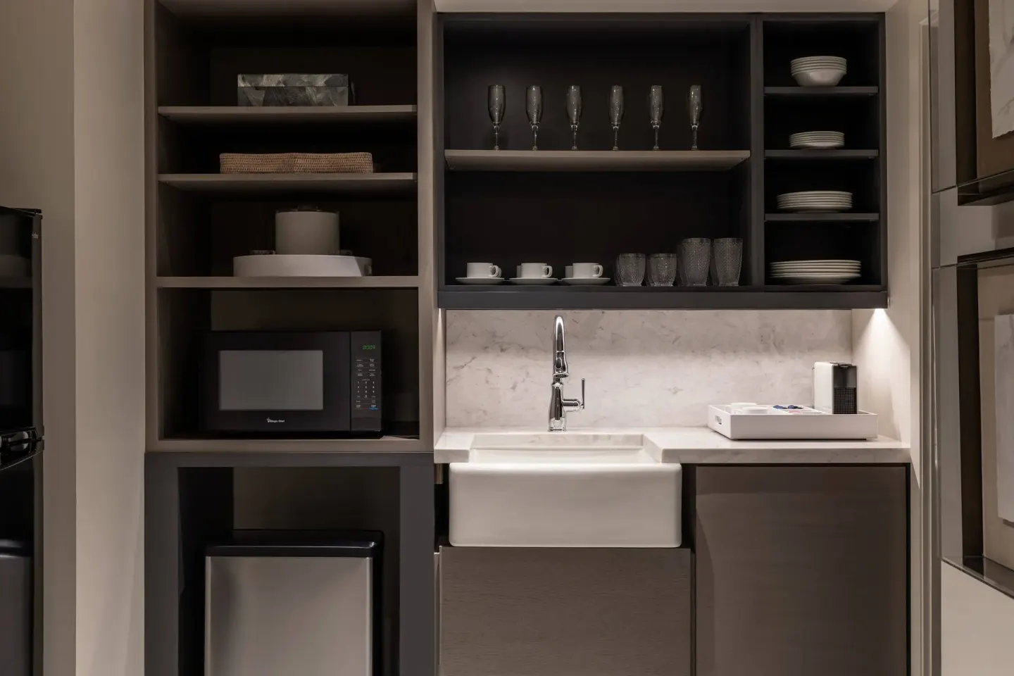 Presidential 1 Bedroom Suite kitchenette at The Ritz-Carlton, St. Thomas with sink and open shelves.