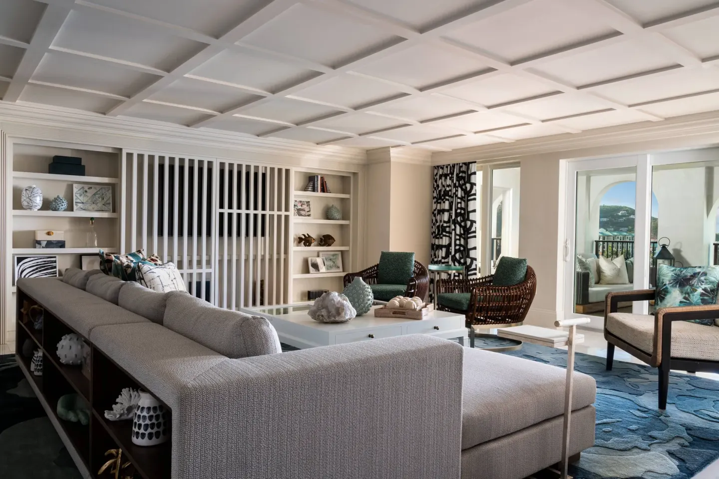 Presidential 1 Bedroom Suite living room at The Ritz-Carlton, St. Thomas with sofa and balcony doors.