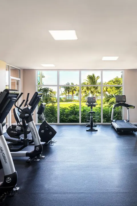 Fitness center cardio machines face garden windows at The Ritz-Carlton, Turks & Caicos.