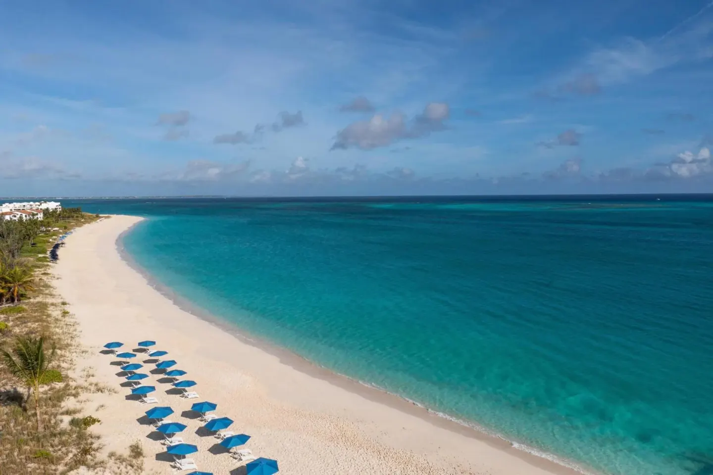 Aerial view of Grace Bay beach and turquoise water at The Ritz-Carlton, Turks & Caicos.