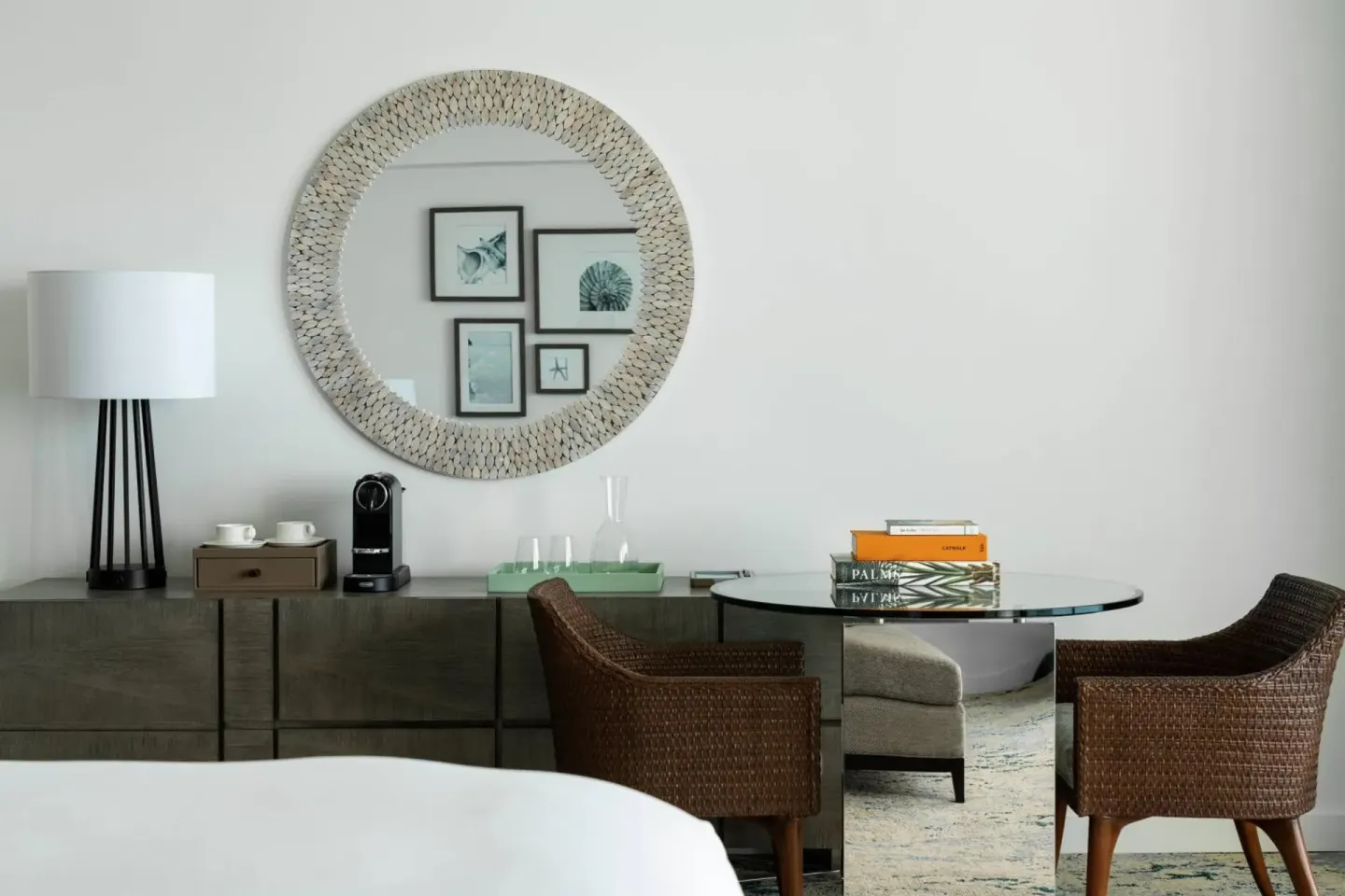 Guest room desk, coffee setup and round mirror at The Ritz-Carlton, Turks & Caicos.