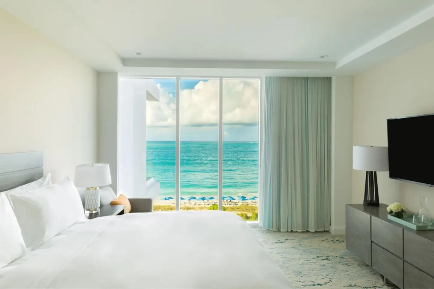 Ocean view king bedroom with floor-to-ceiling windows at The Ritz-Carlton, Turks & Caicos.
