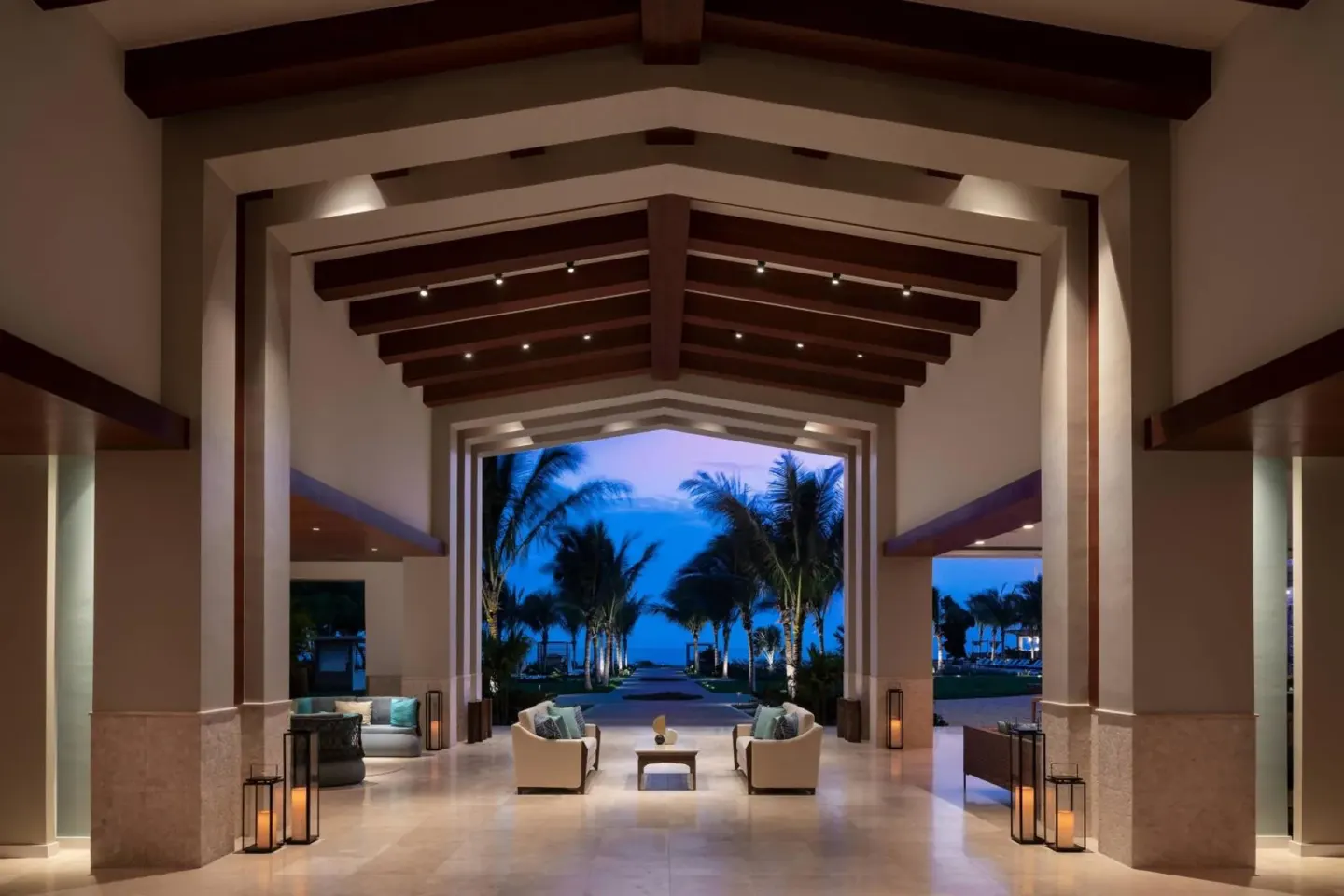 Open-air lobby looking toward palm trees at The Ritz-Carlton, Turks & Caicos.