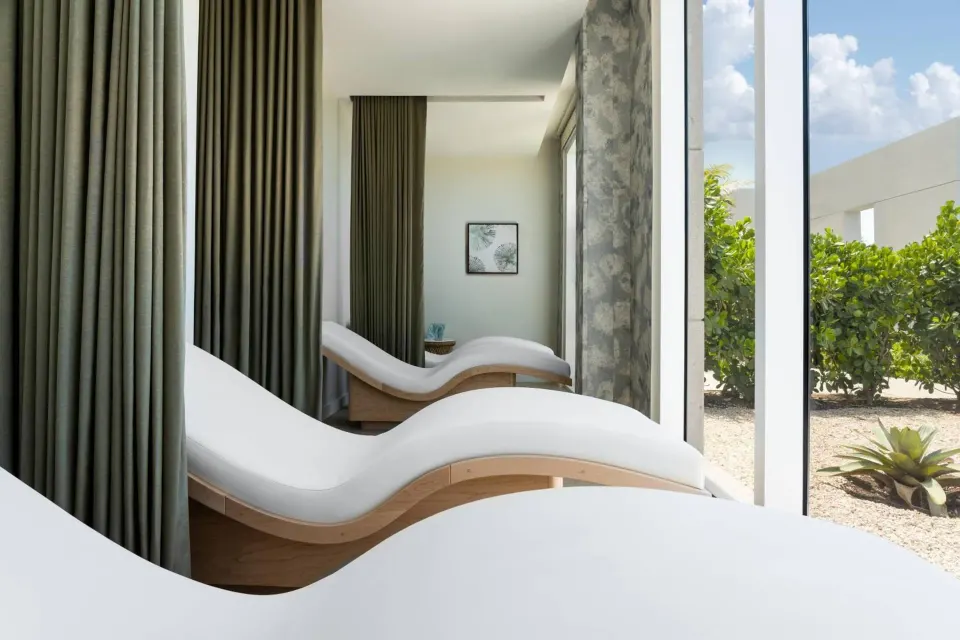 Curved spa loungers face garden windows at The Ritz-Carlton, Turks & Caicos.