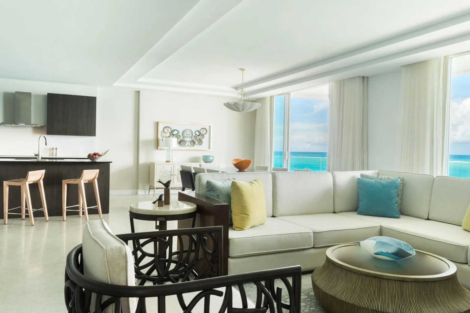 Bright suite living room with kitchen and ocean views at The Ritz-Carlton, Turks & Caicos.