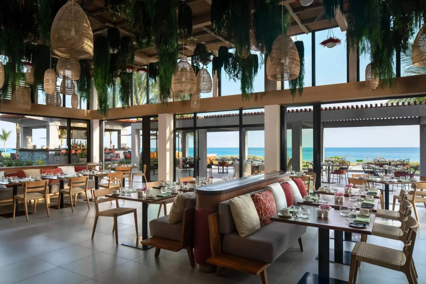 Open-air restaurant dining room with ocean views at The Ritz-Carlton, Turks & Caicos.