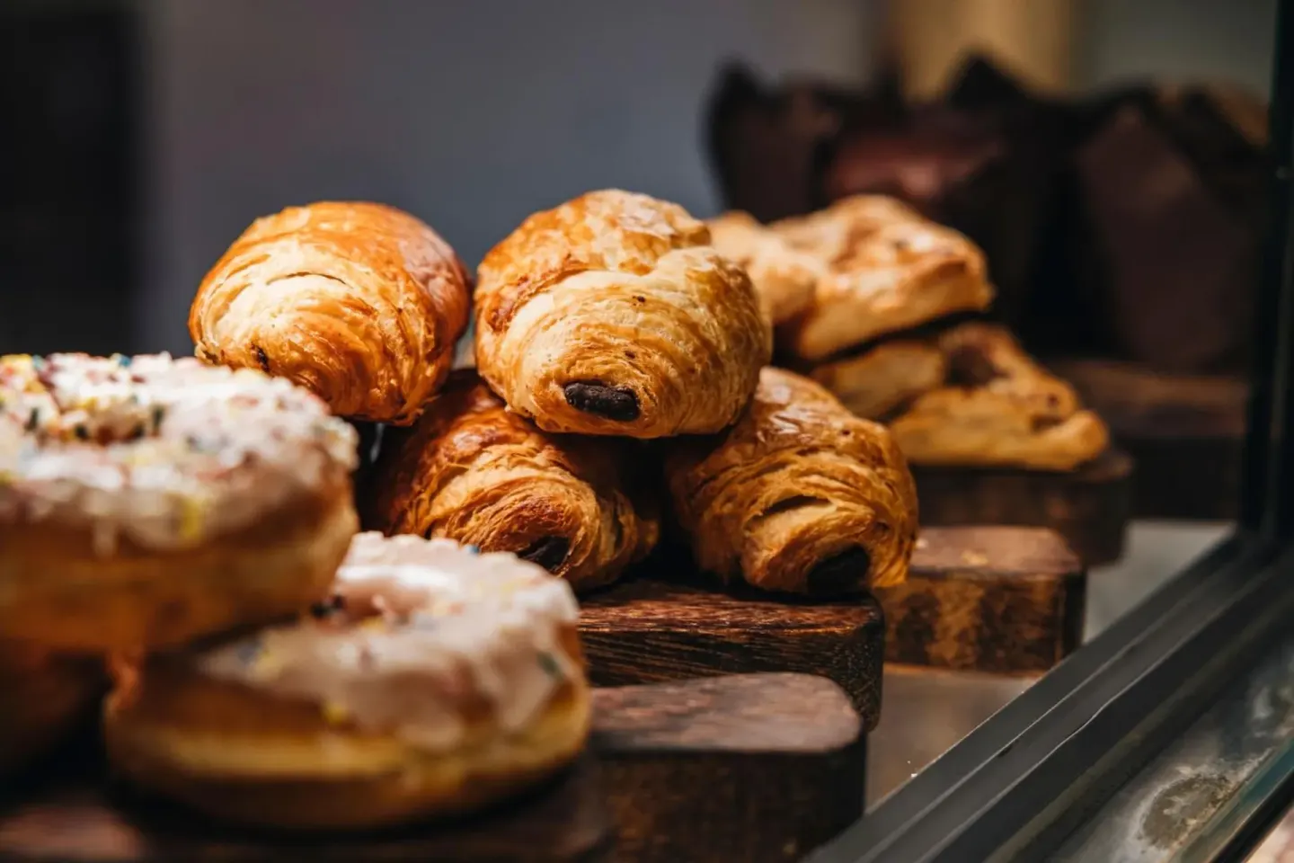Pastries on display at The Ritz-Carlton, Turks & Caicos, including croissants and iced baked goods.