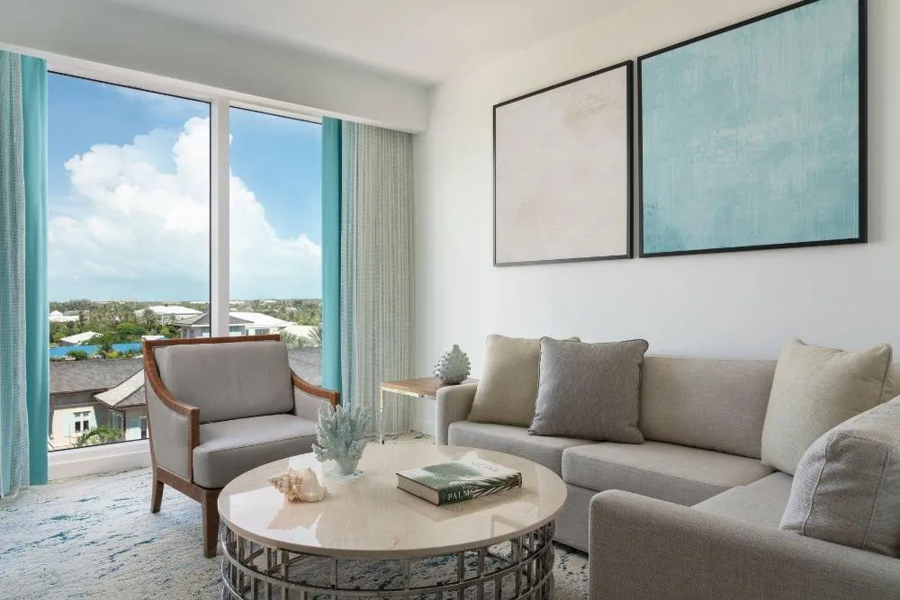 Junior suite sitting area with large windows at The Ritz-Carlton, Turks & Caicos.