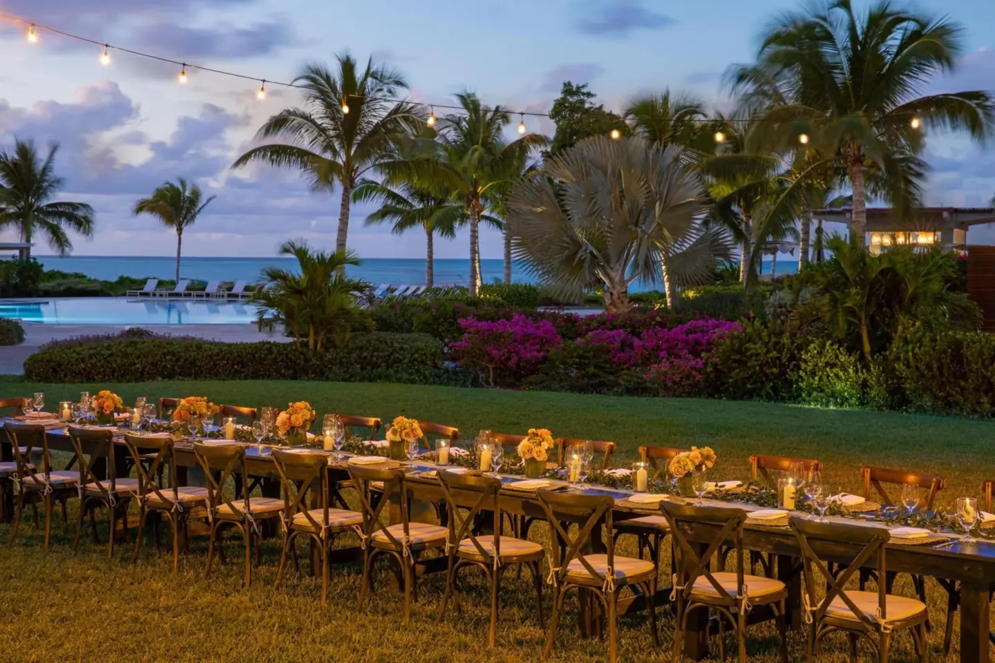 Outdoor event dinner by the pool at The Ritz-Carlton, Turks & Caicos.