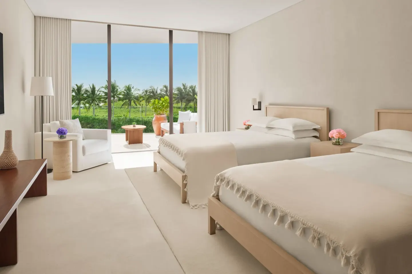 Two-bed guest room with terrace and palm views at The Riviera Maya EDITION At Kanai.