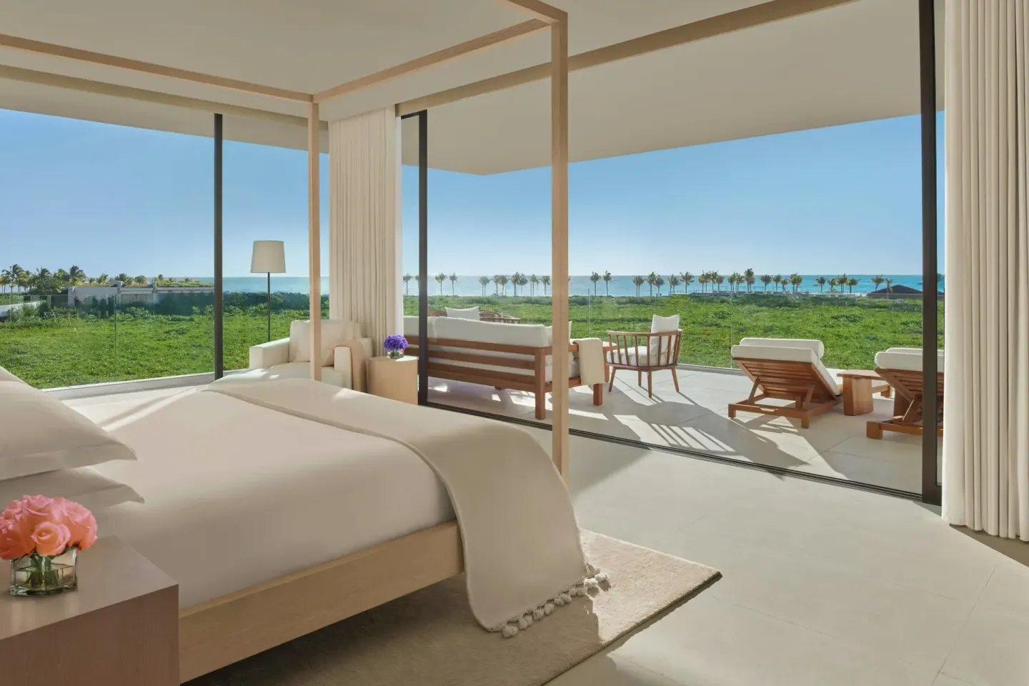 King bed room with ocean-facing terrace at The Riviera Maya EDITION At Kanai.