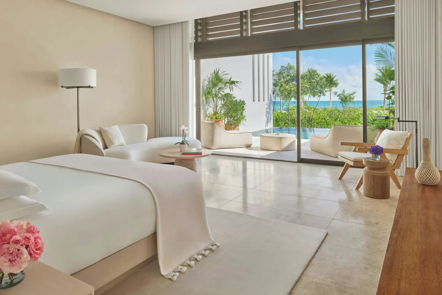 King bed suite with seating and plunge pool terrace at The Riviera Maya EDITION At Kanai.