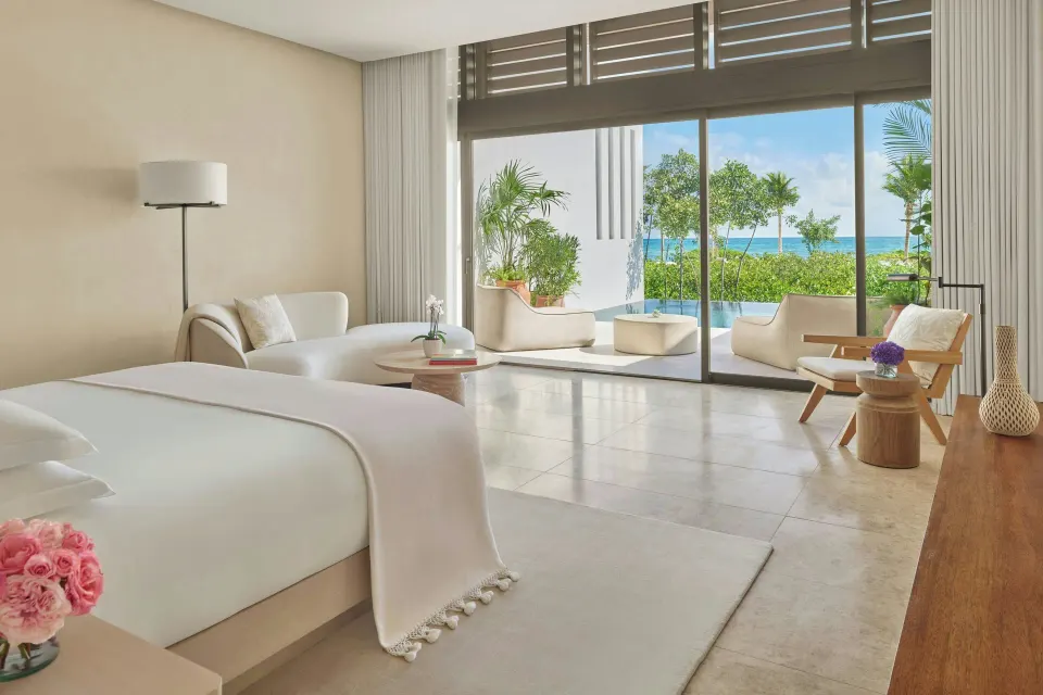 King bed suite with sofa and terrace pool at The Riviera Maya EDITION At Kanai.
