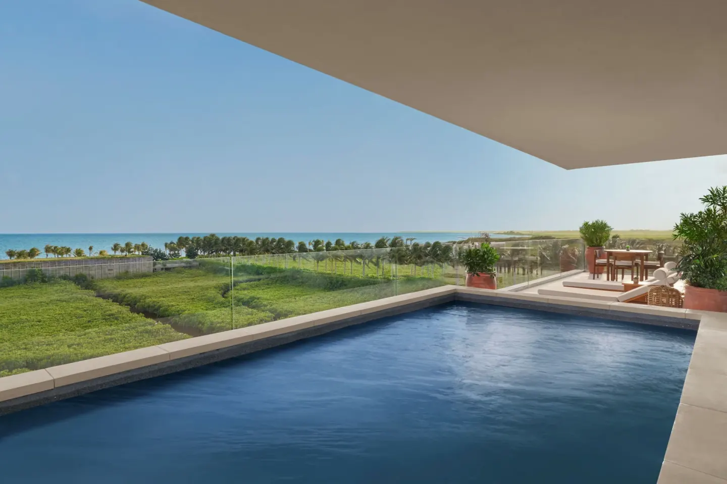 Private terrace pool at The Riviera Maya EDITION At Kanai overlooking greenery and the sea.