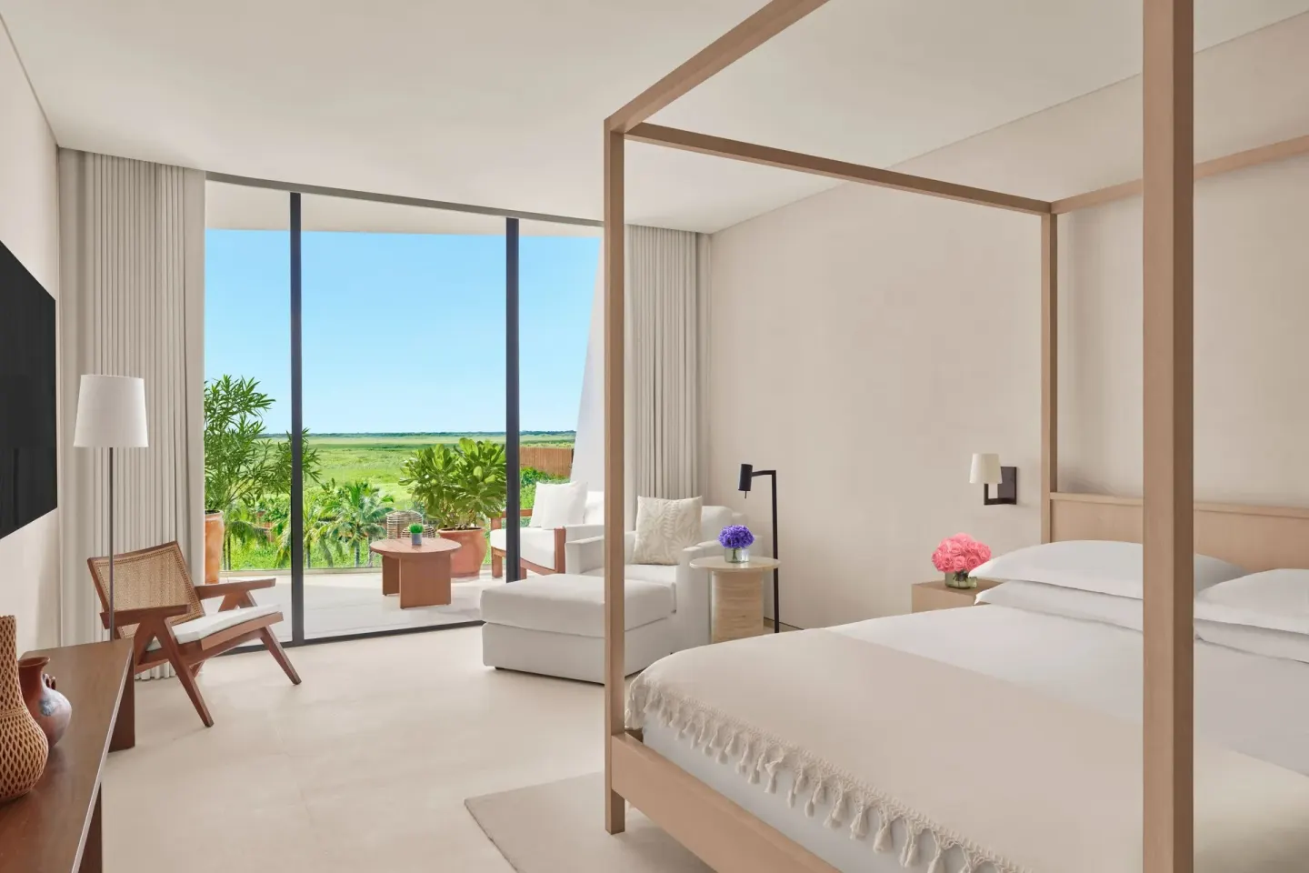 King bed room with green terrace view at The Riviera Maya EDITION At Kanai.