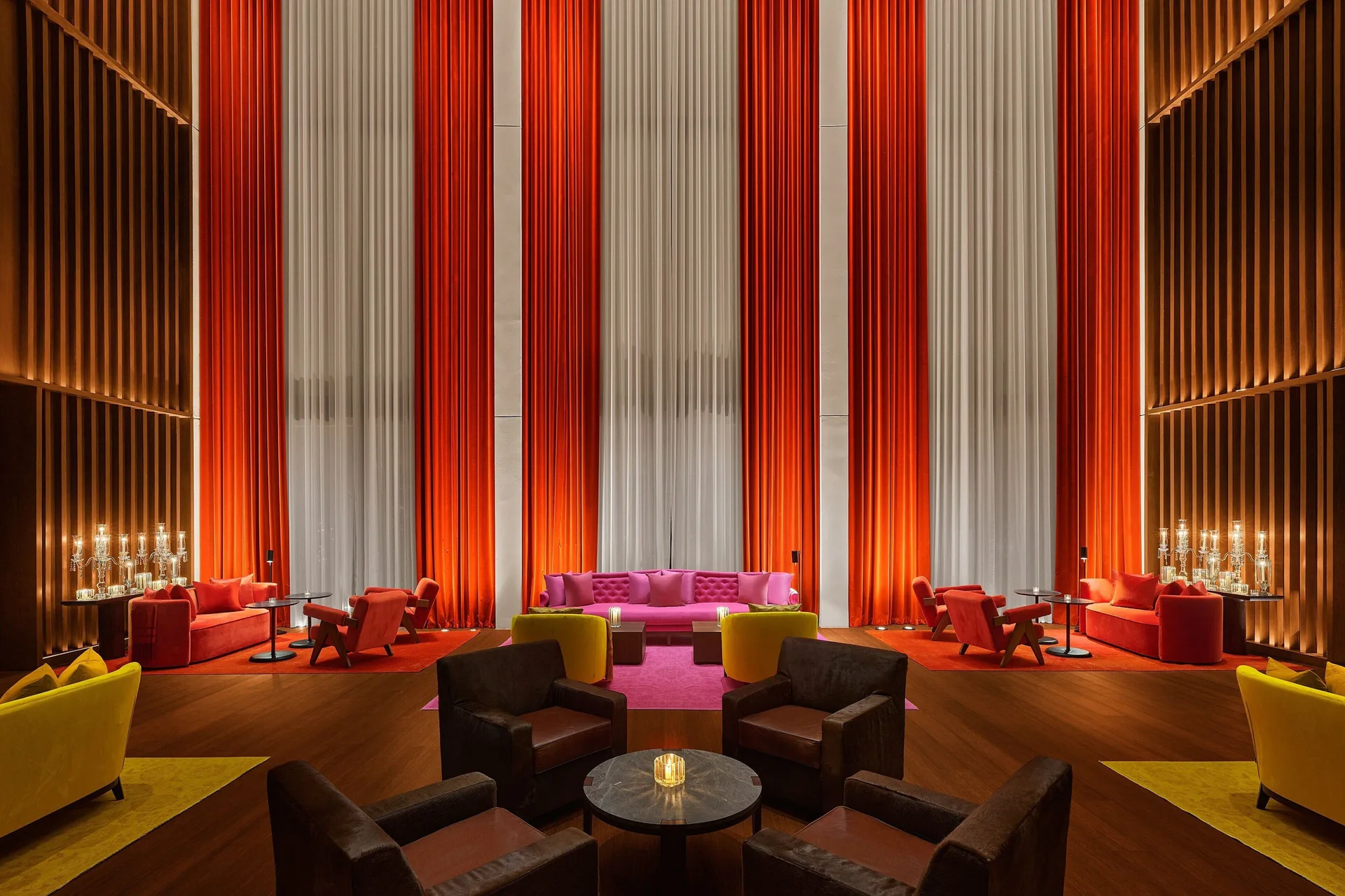 Colorful lobby bar lounge with tall curtains at The Riviera Maya EDITION At Kanai.