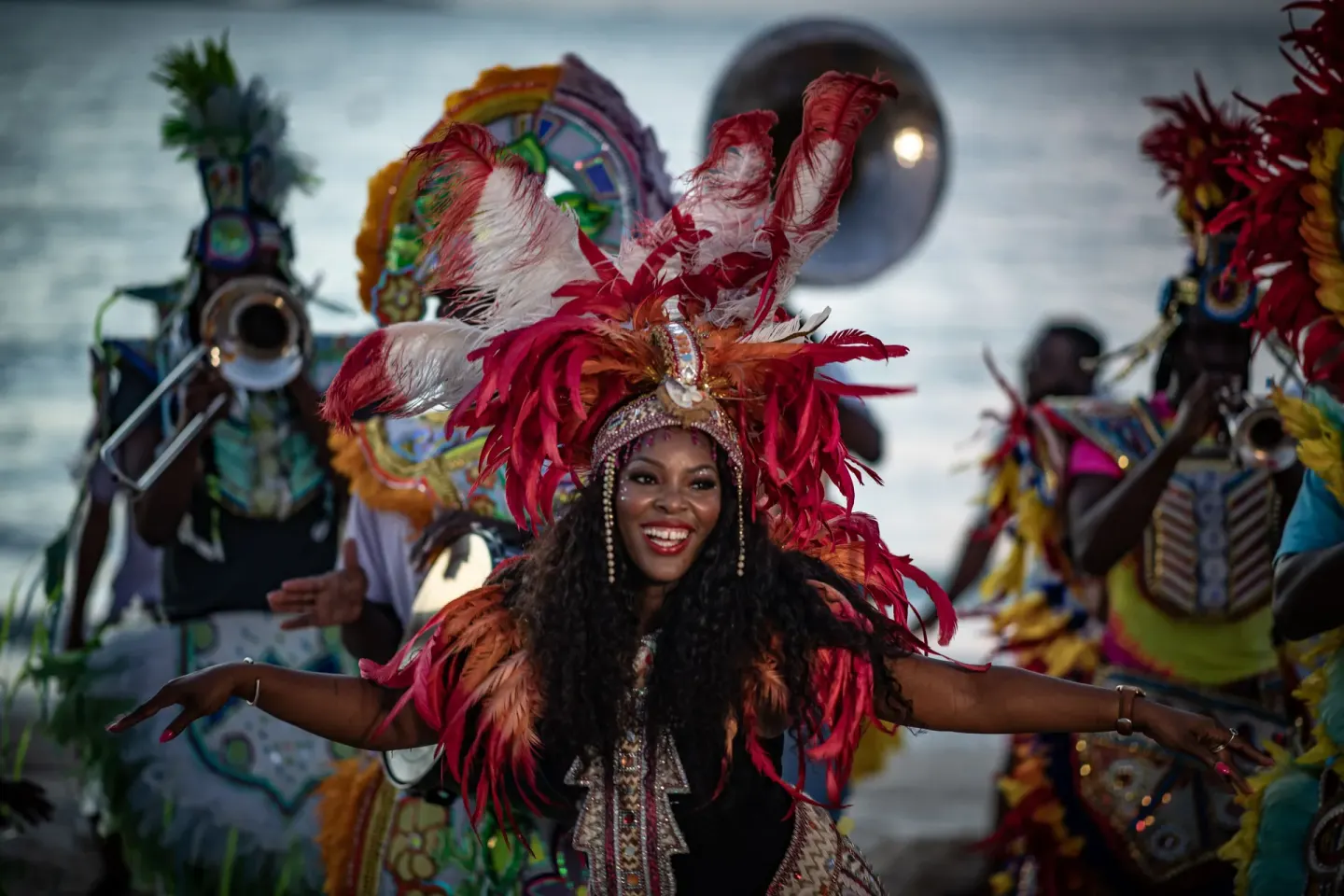 A costumed performer dances with musicians behind her at The Royal at Atlantis.