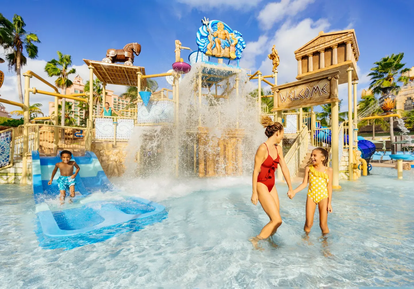 Children play in a shallow water playground at The Royal at Atlantis.