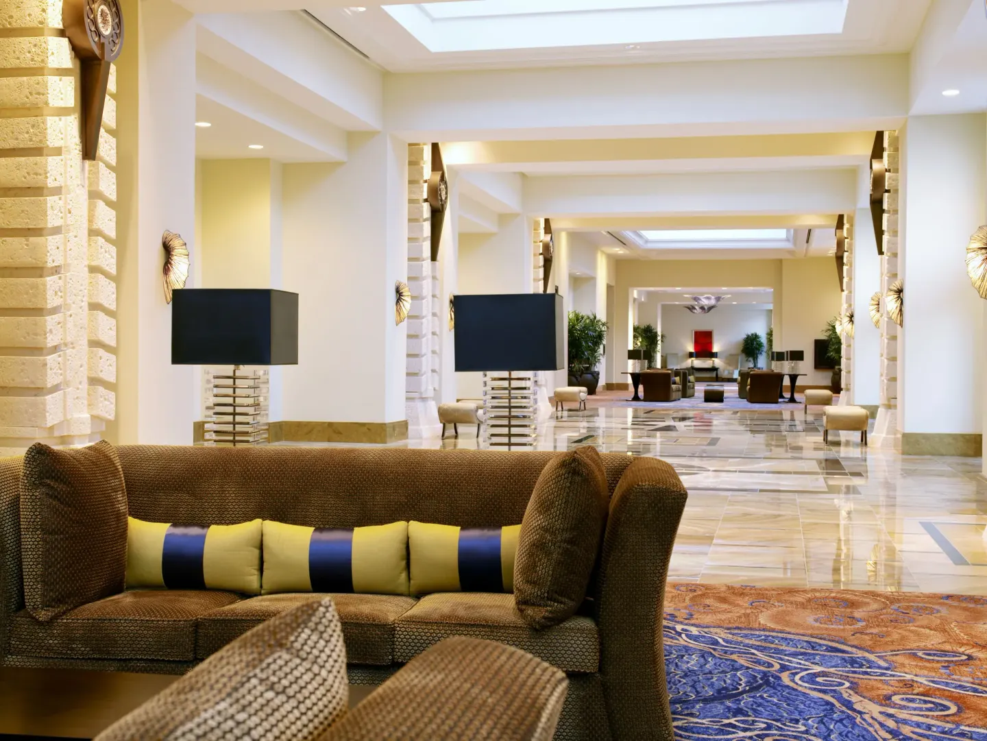 Bright lobby seating area with polished floors at The Royal at Atlantis.