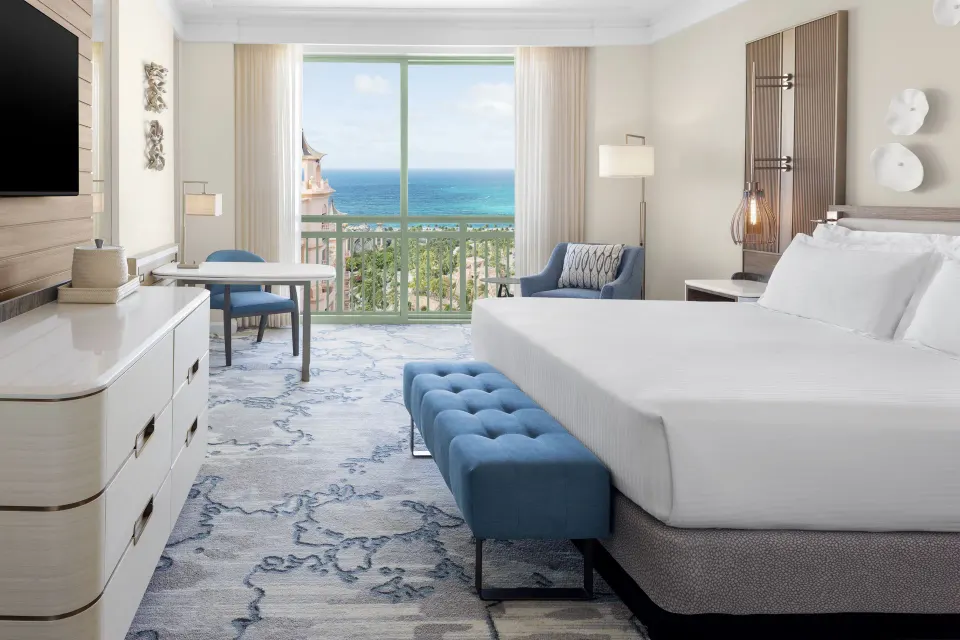 A king guest room at The Royal at Atlantis has a balcony view of the ocean.