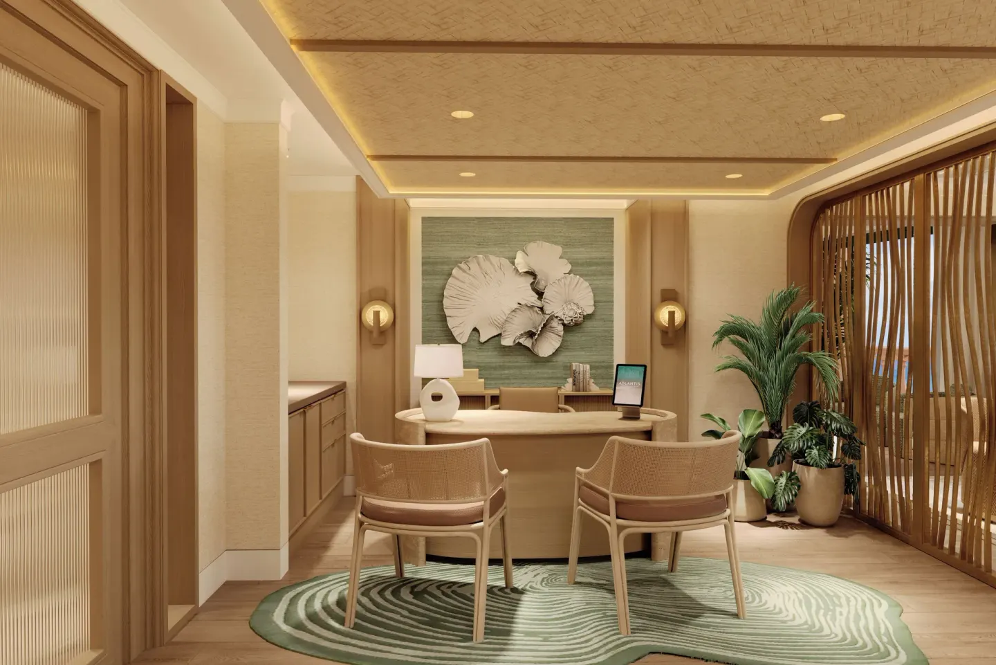 Reception desk with shell wall art and seating at The Royal at Atlantis.