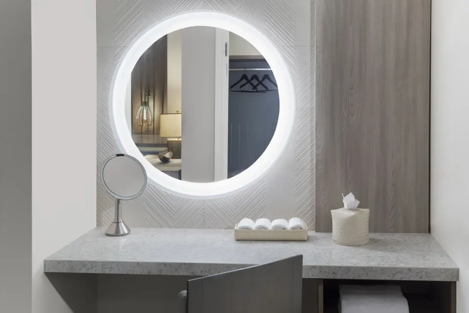 1 Bedroom Regal Suite vanity with illuminated round mirror at The Royal at Atlantis.