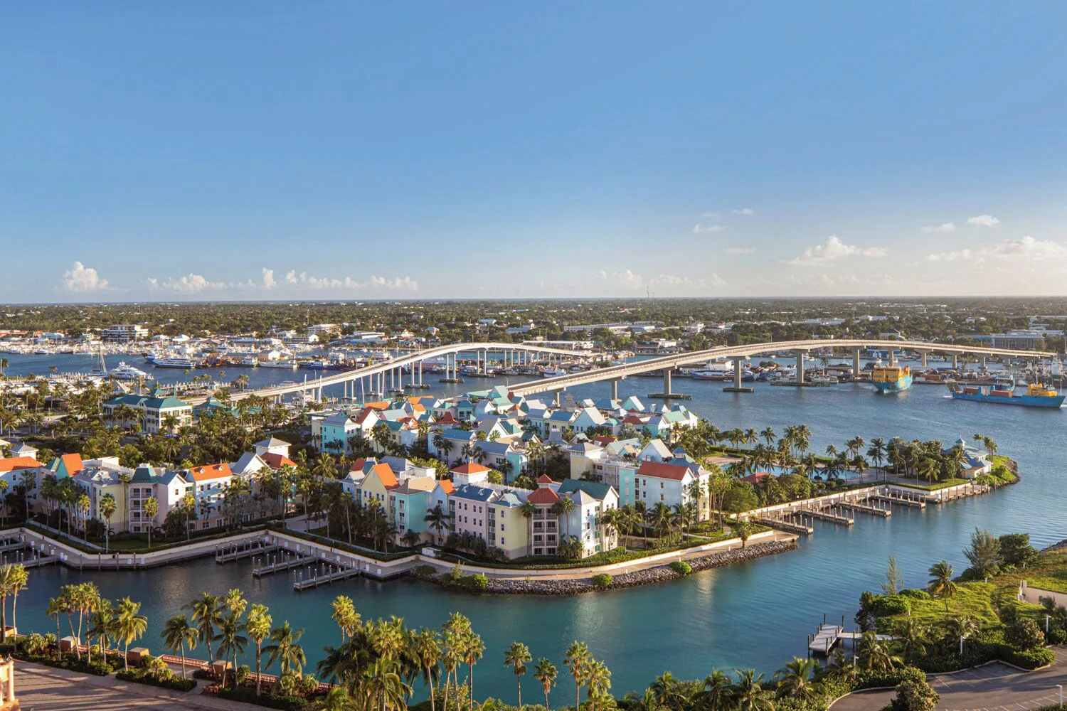 Harbor view with bridge, marina, and colorful buildings at The Royal at Atlantis.