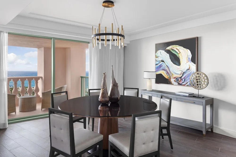 Imperial Club suite dining area with round table and balcony at The Royal at Atlantis.