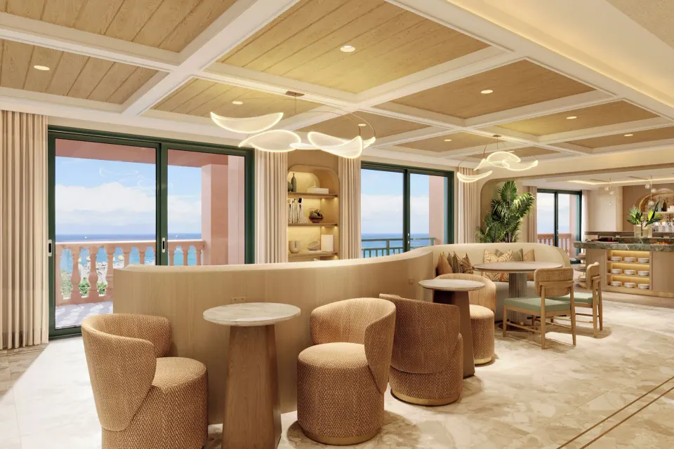 Imperial Club lounge seating with ocean-facing windows at The Royal at Atlantis.