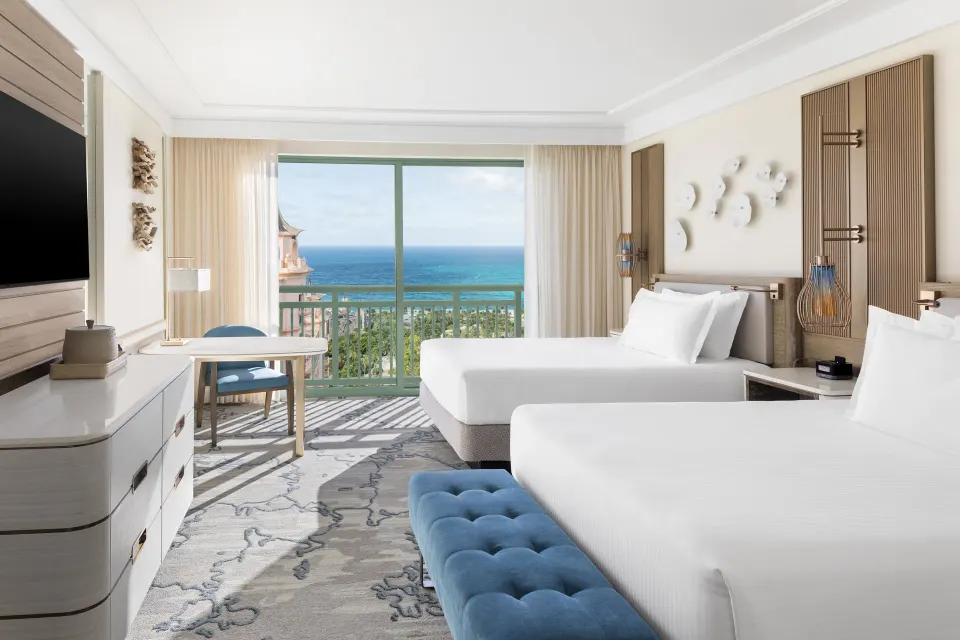 Two-queen Water View guest room with ocean-facing balcony at The Royal at Atlantis.