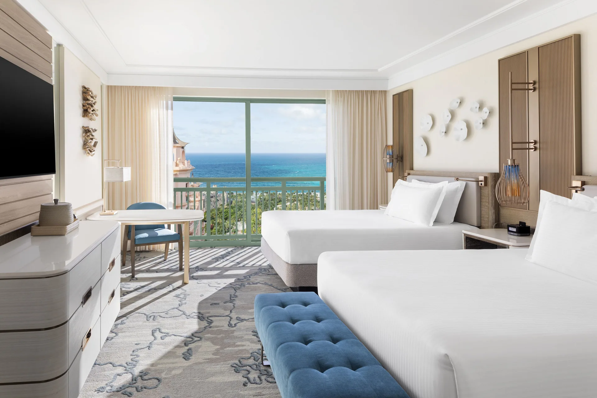 Two-queen Water View guest room with ocean-facing balcony at The Royal at Atlantis.