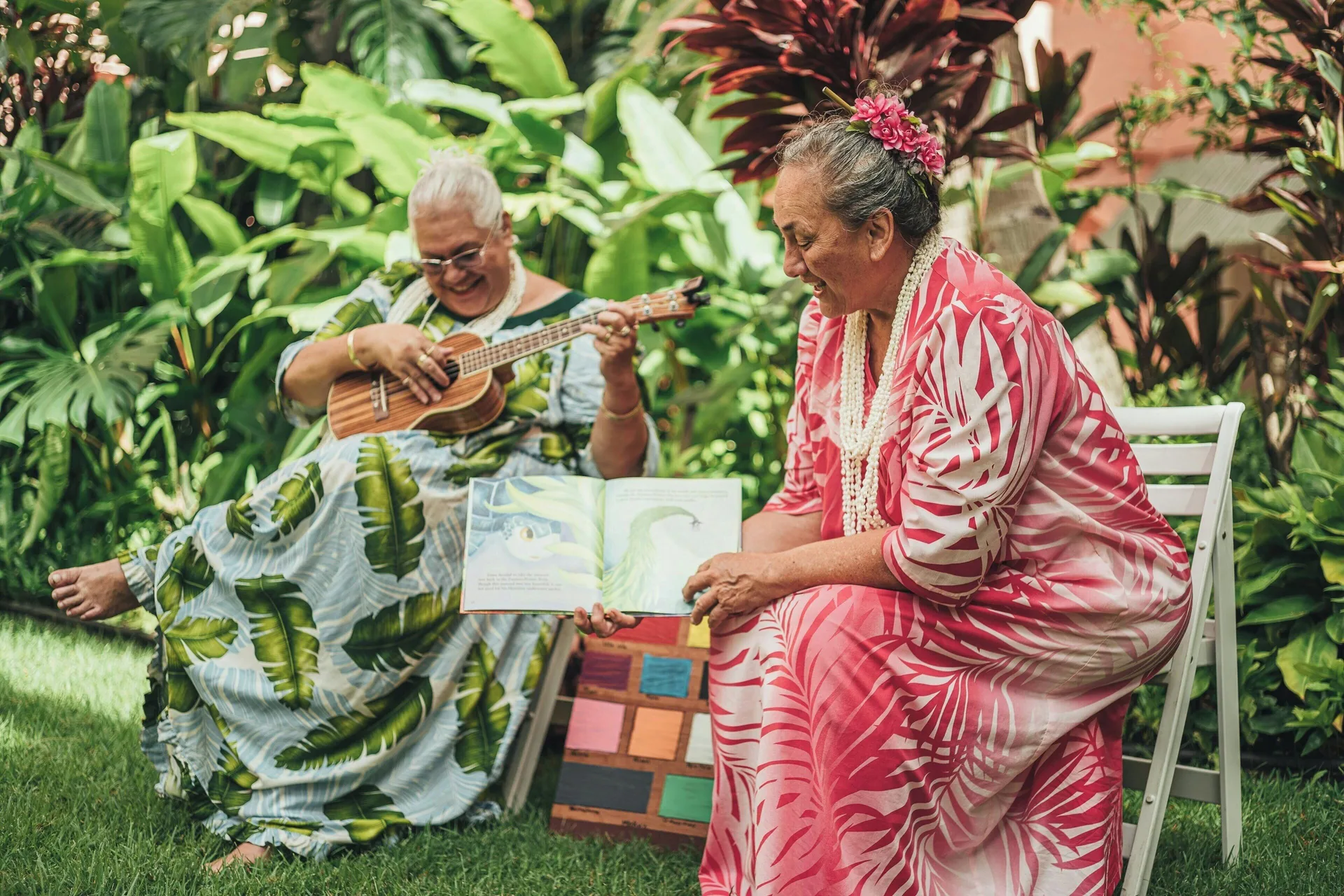 Musician and storyteller seated in the tropical gardens at The Royal Hawaiian, Waikiki.