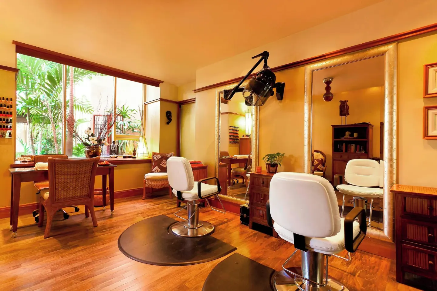 Salon room with styling chairs, mirrors, and manicure tables at The Royal Hawaiian, Waikiki.