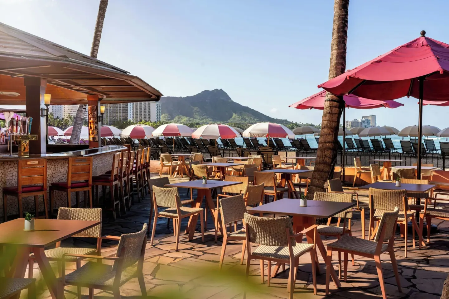 Beachfront bar patio with Diamond Head view at The Royal Hawaiian, Waikiki.