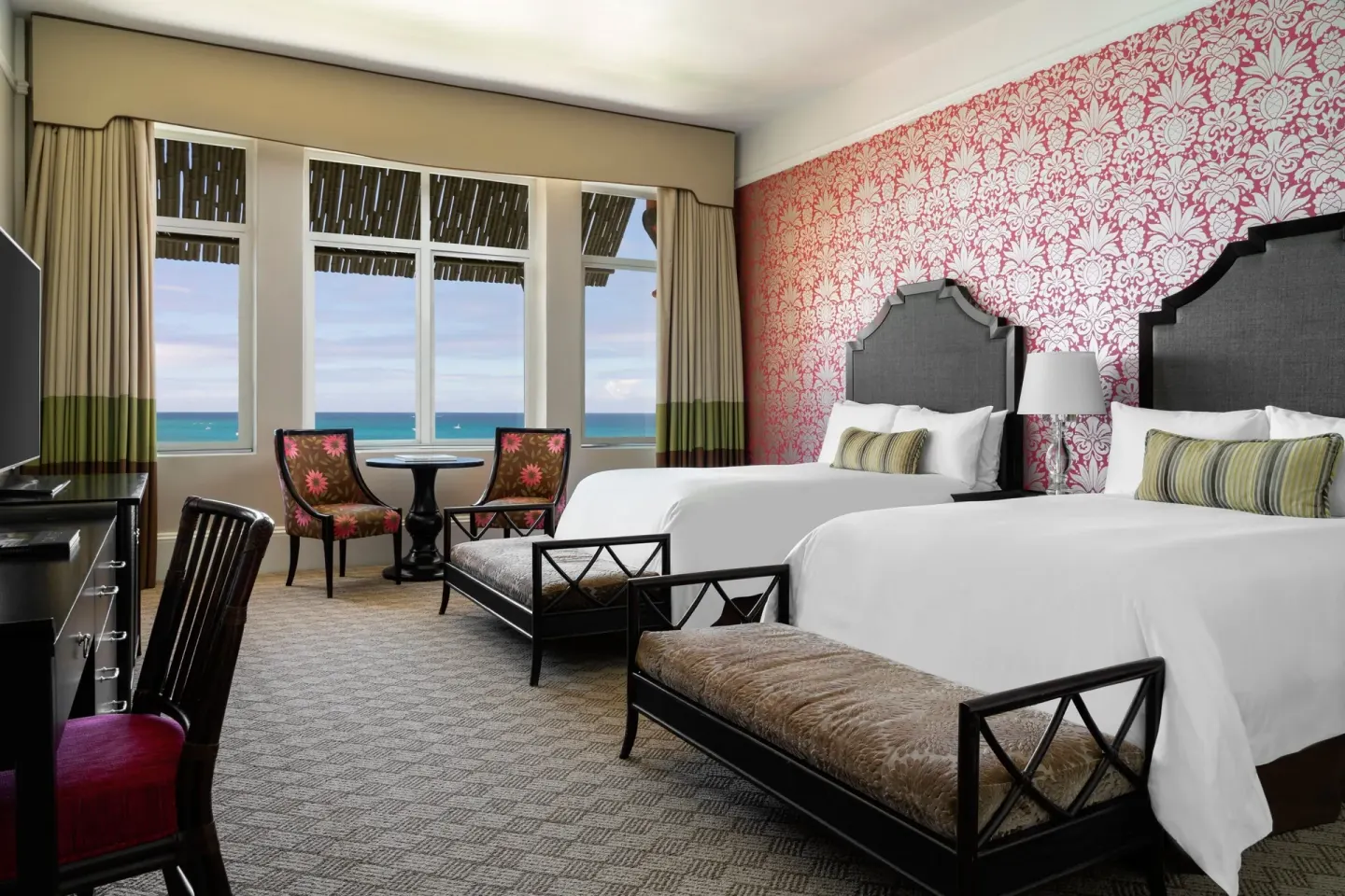 Deluxe Historic Wing room with two beds and ocean-view windows at The Royal Hawaiian, Waikiki.