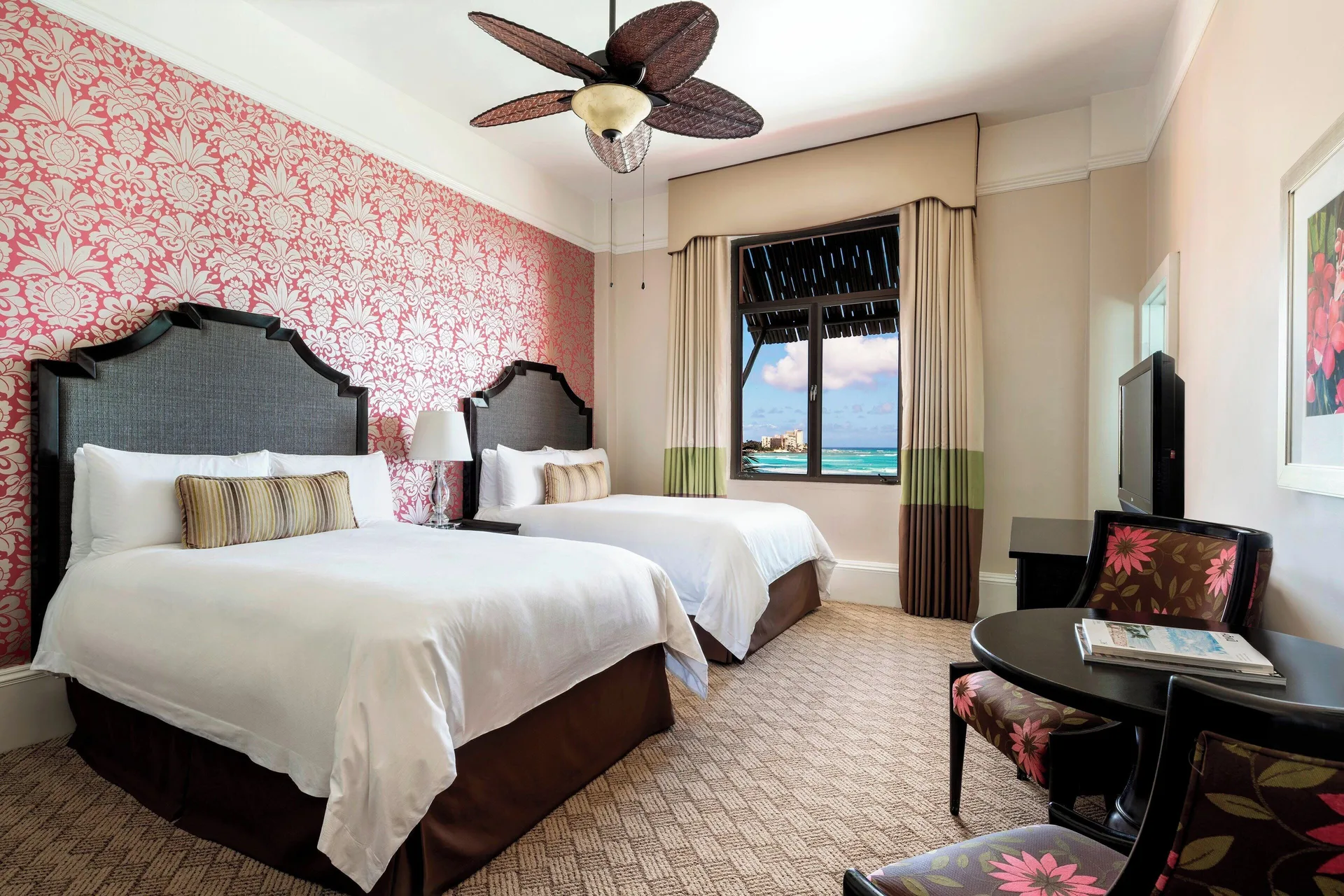 Historic Ocean room with two beds and a window view at The Royal Hawaiian, Waikiki.