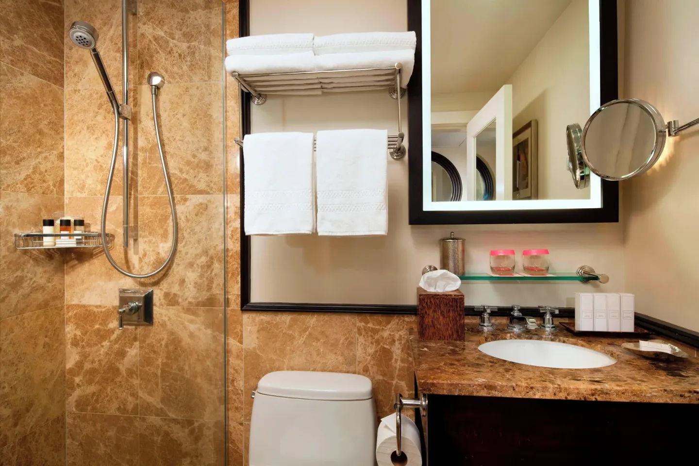 Accessible bathroom with shower, towels, and vanity at The Royal Hawaiian, Waikiki.