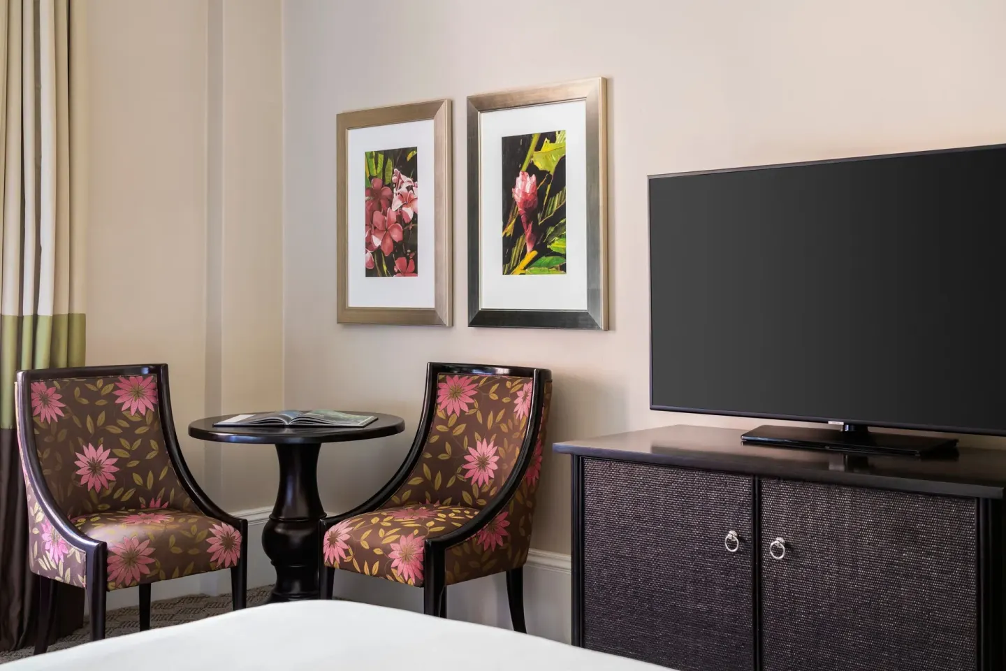 Seating area and television in a Historic Room 1 at The Royal Hawaiian, Waikiki.