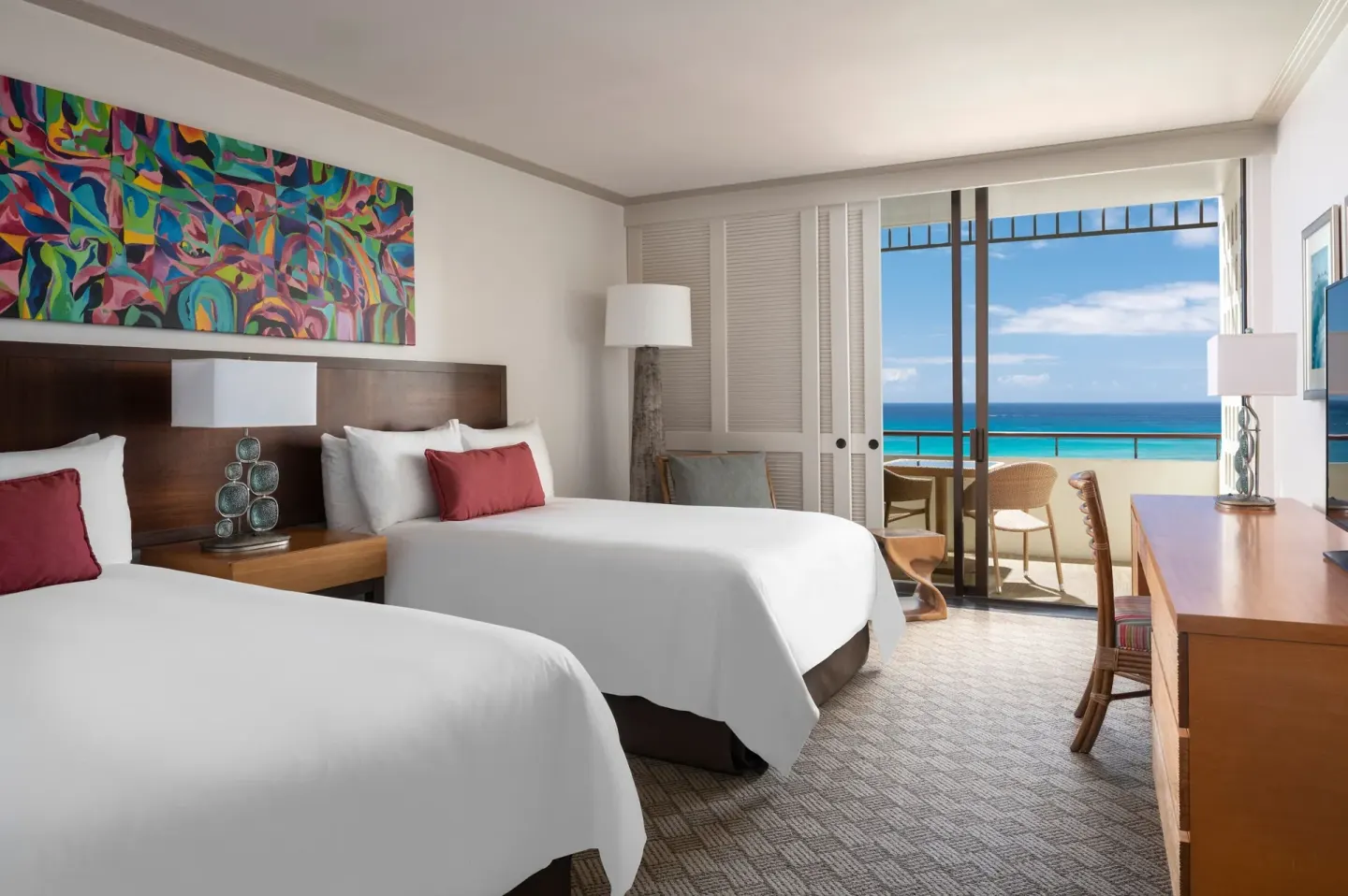 Two-bed Mailani Tower guest room with ocean-facing lanai at The Royal Hawaiian, Waikiki.