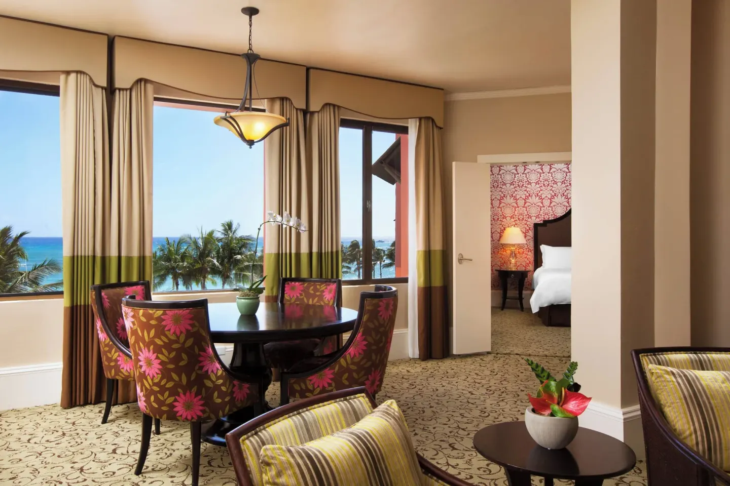 Ocean-view suite dining area and bedroom doorway at The Royal Hawaiian, Waikiki.