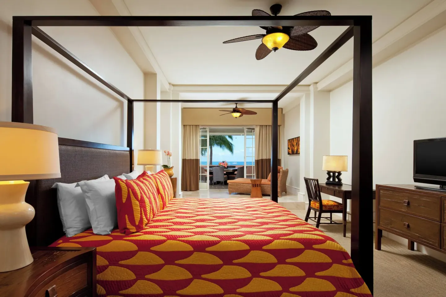 Prestige Suite bedroom with four-poster bed and ocean-facing lanai at The Royal Hawaiian, Waikiki.