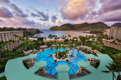 Aerial view of pool, beach and bay at The Royal Sonesta Kaua'i Resort Lihue.