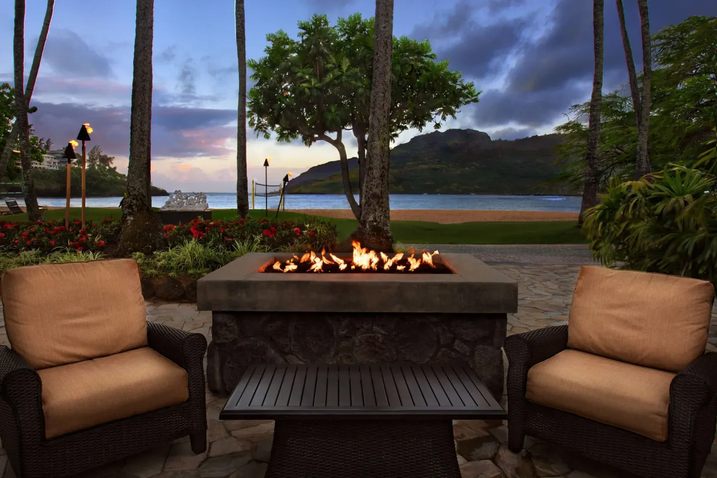Fire pit seating by the beach at The Royal Sonesta Kaua'i Resort Lihue.